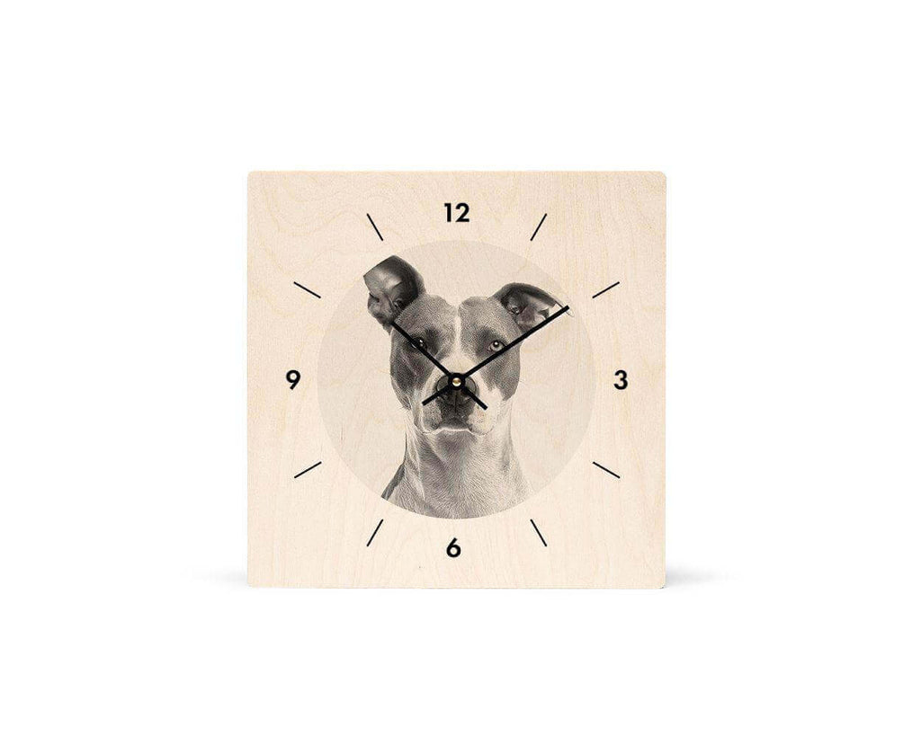 Dog face integrated into a customized wood clock design for a personalized touch.