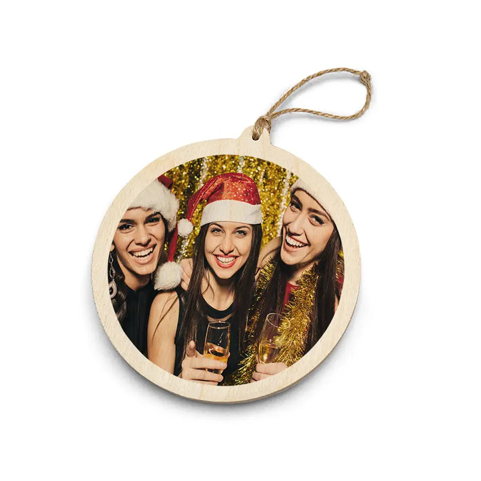 Circular wooden ornament with photo print and twine hanger for WoodSnap’s Christmas wood ornaments.