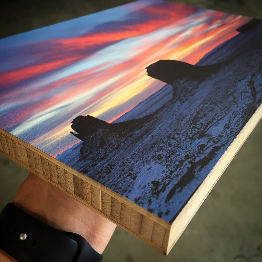 Canvas print of a sunset sky over snowy mountains on WoodSnap’s eco-friendly bamboo.