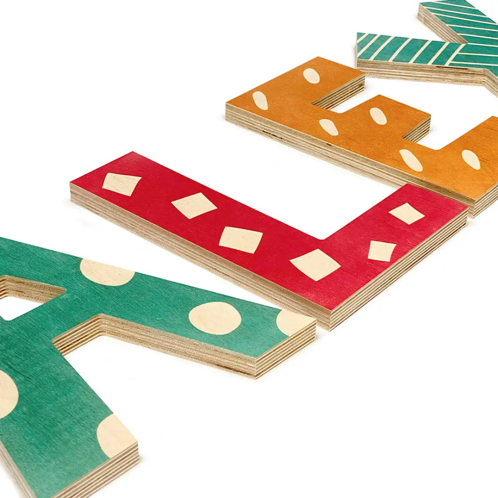 Colorful wooden domino-like pieces with various geometric patterns.