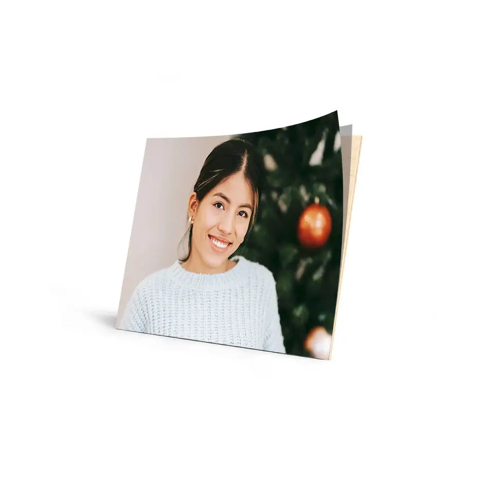 Smiling woman in a white sweater with Christmas ornaments on a 10x14 Cove Photo Mount Print