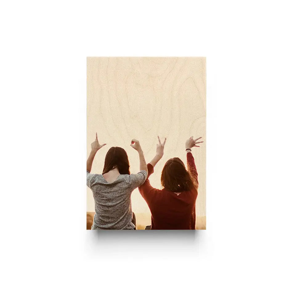 Two women admiring a wooden wall featuring the 10x24 Original Cove Print