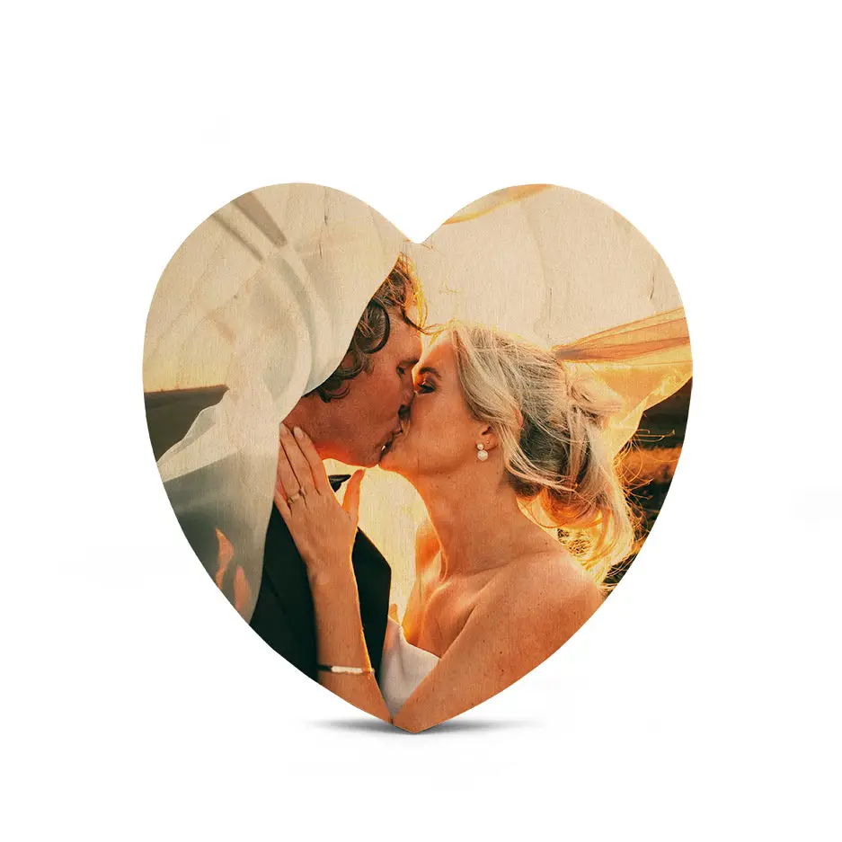 Couple kissing in a heart shaped photo on a 12 Inch Heart Wood Print Vintage