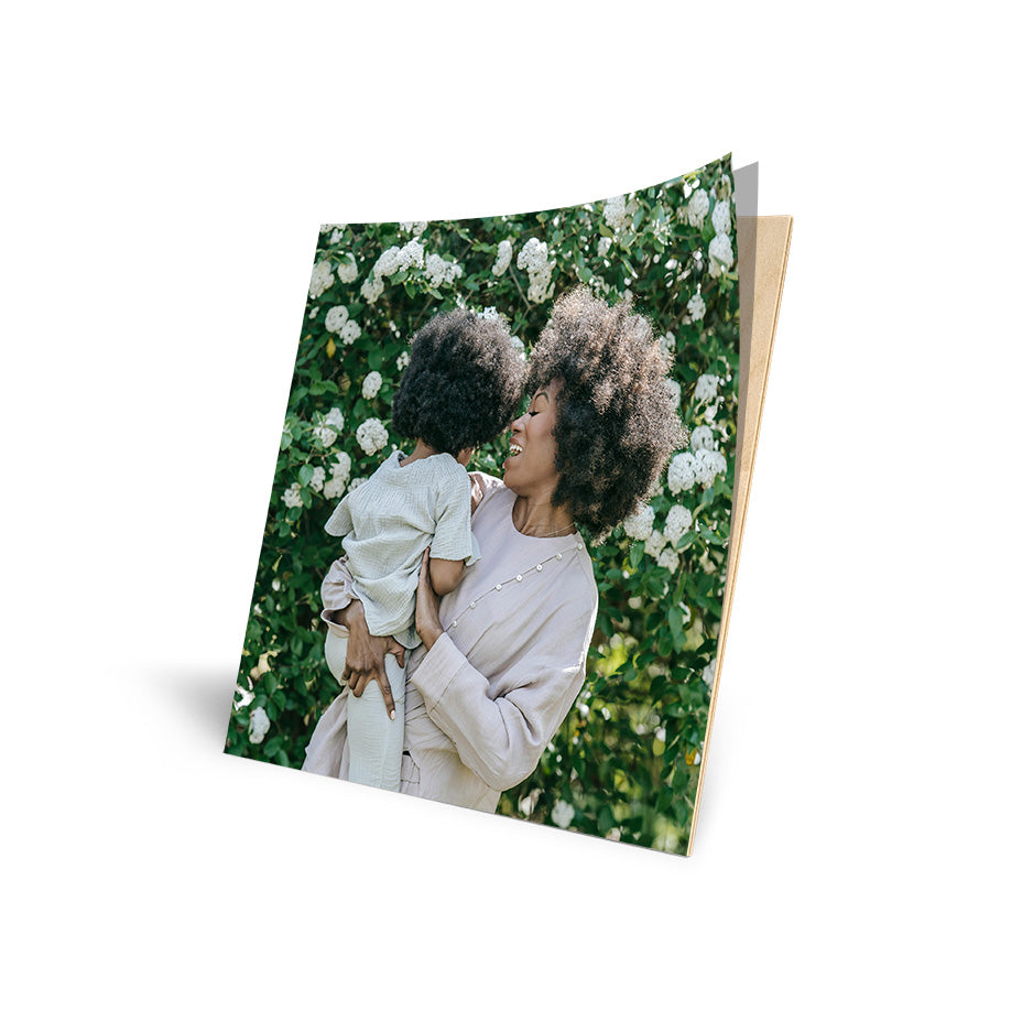 Photo album with mother and child showcasing 12x12 Cove Photo Mount Wood Print