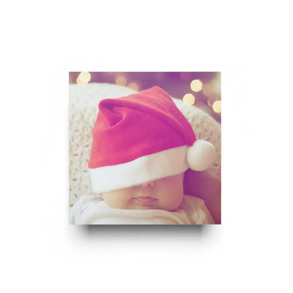 Baby in a pink and white Santa hat with 12x12 cove photo mount design