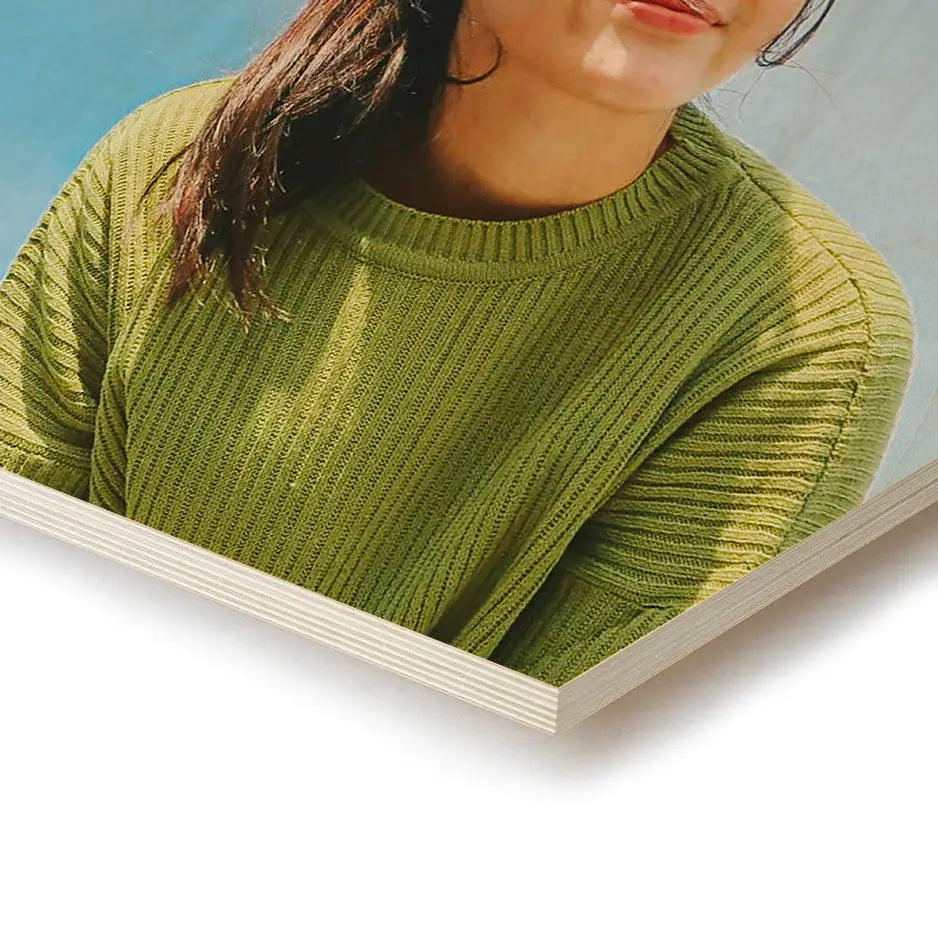 Woman in a green sweater and sunglasses with a 12x12 hexagon wood print vintage backdrop