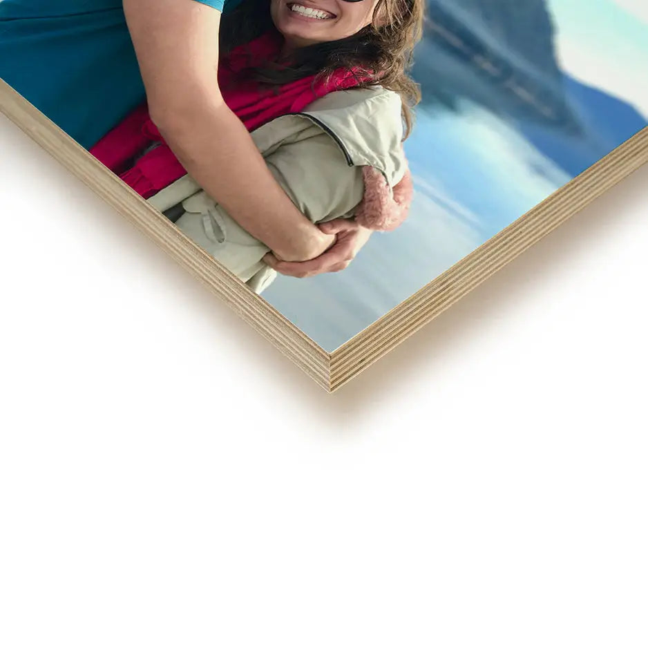 Woman holding a photo on a white background with a 12x18 wood print bright display