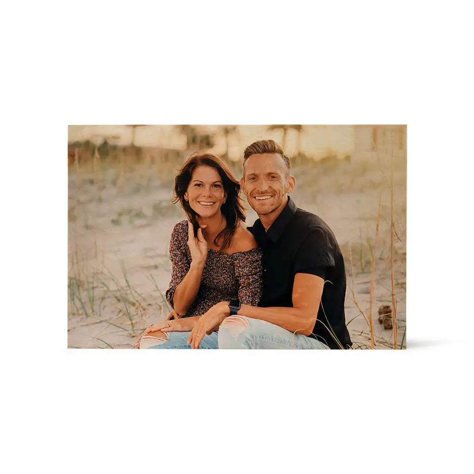 Couple sitting on the beach in sand, featured in 12x18 Wood Print Vintage Matte