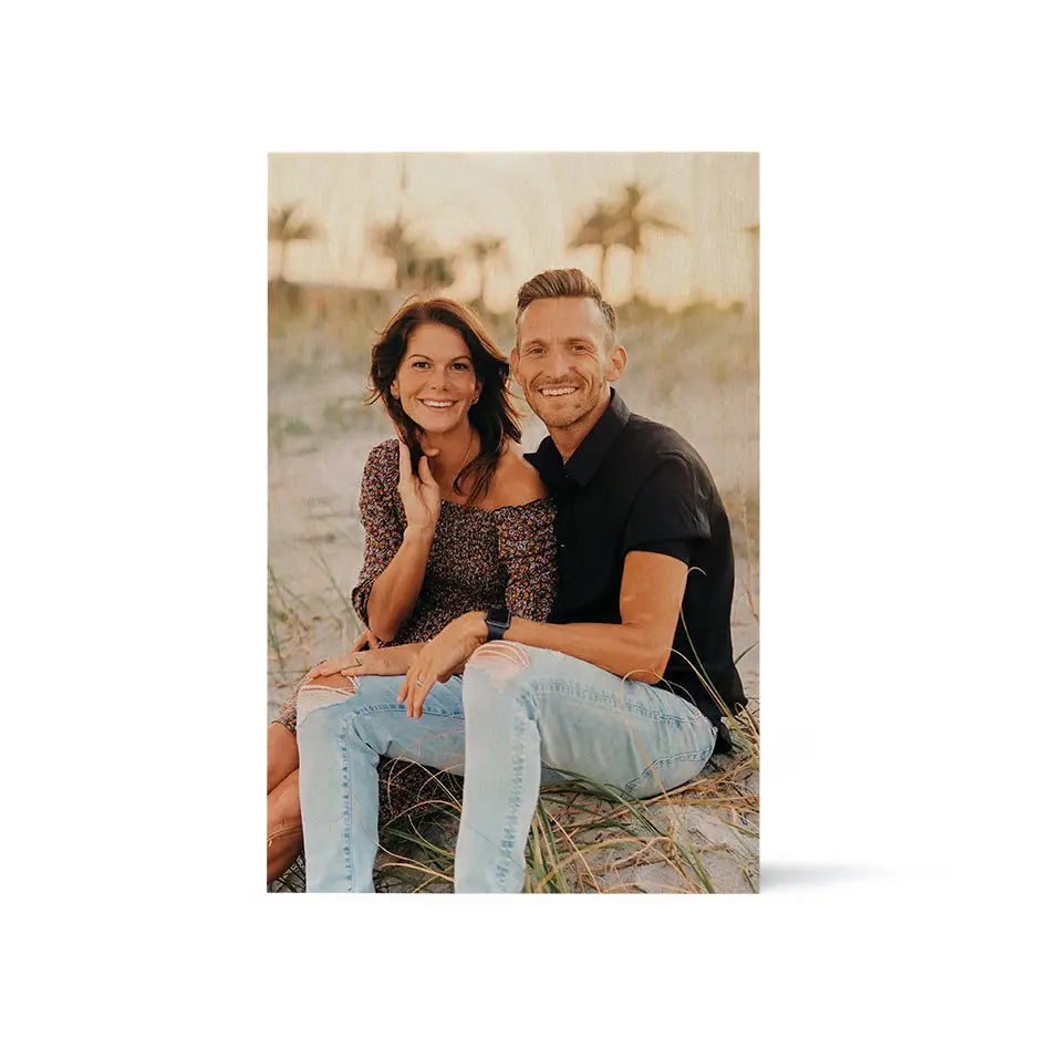 Couple sitting on the beach with 12x18 wood print vintage art in white background