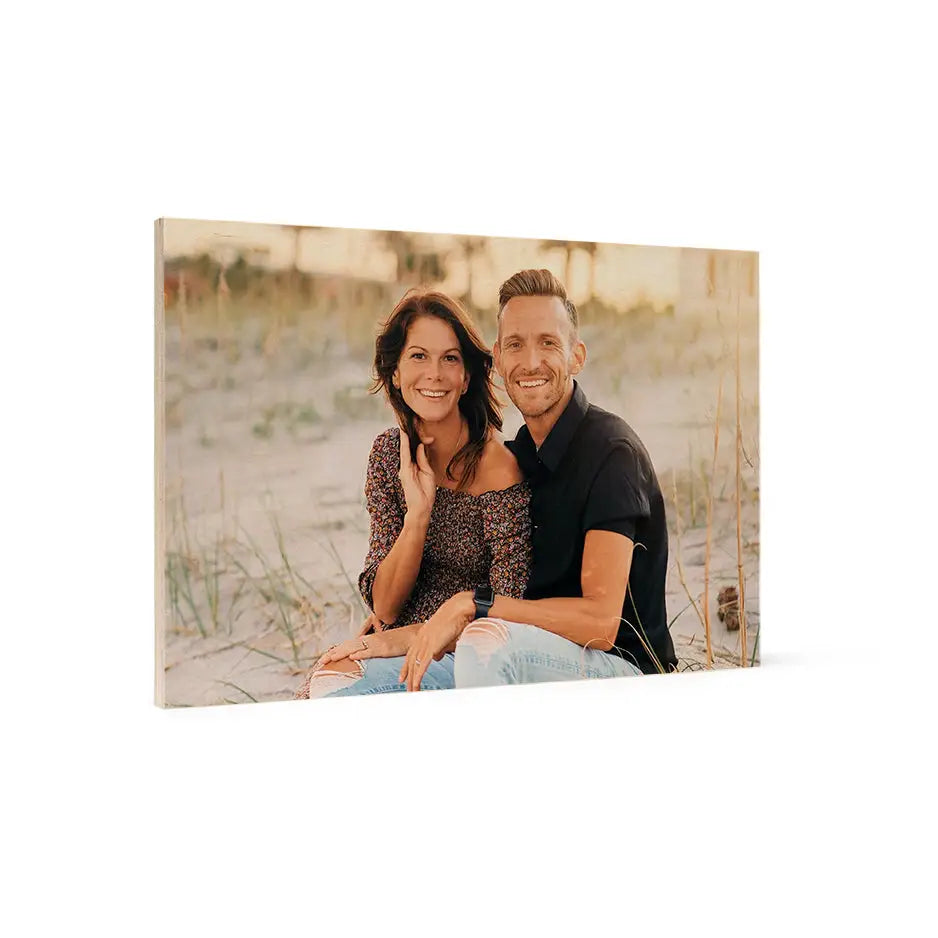 Couple sitting on the beach featured in a 12x18 wood print vintage design