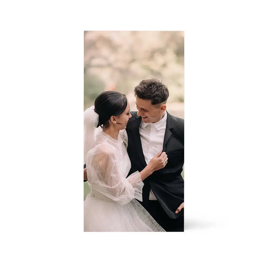 Bride and groom pose for a wedding photo on a 12x24 Birch Photo Mount