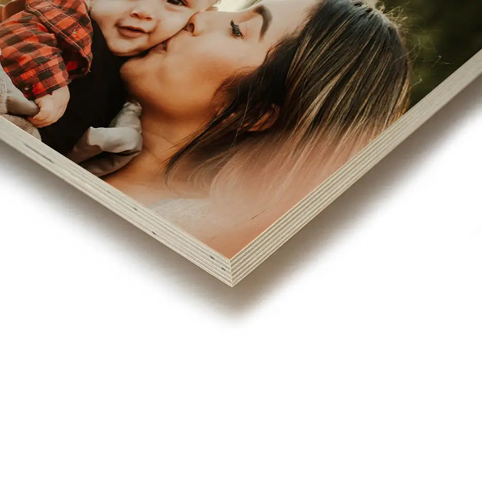 Mother kissing baby in a 12x24 Wood Print Vintage for lasting memories