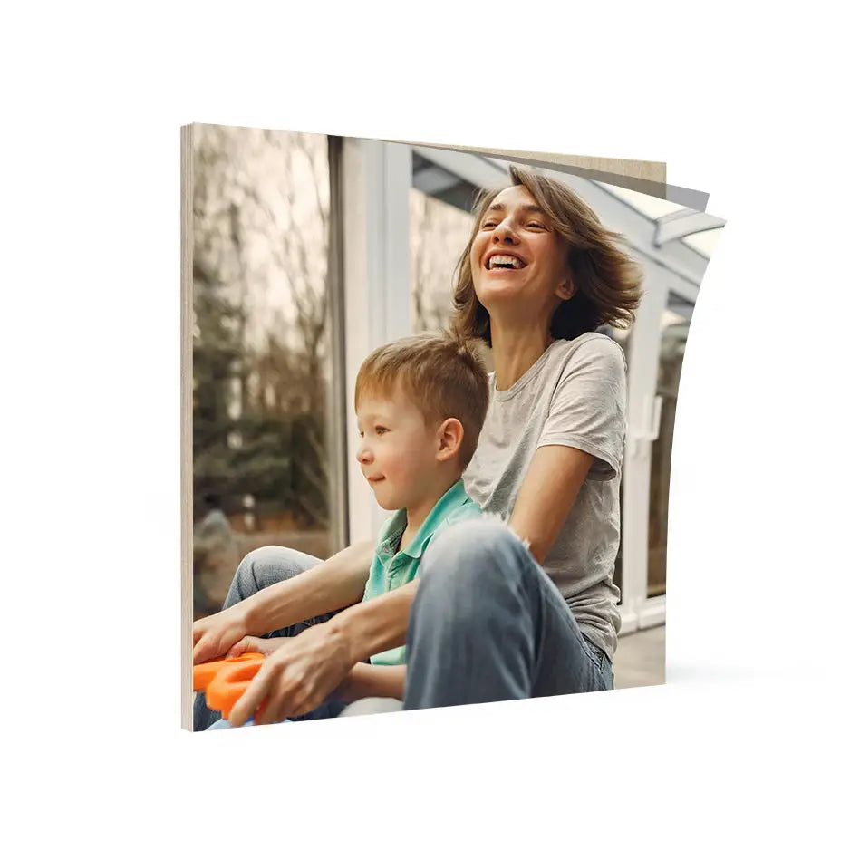 Woman and child playing with a toy on a 16x16 Birch Photo Mount Print