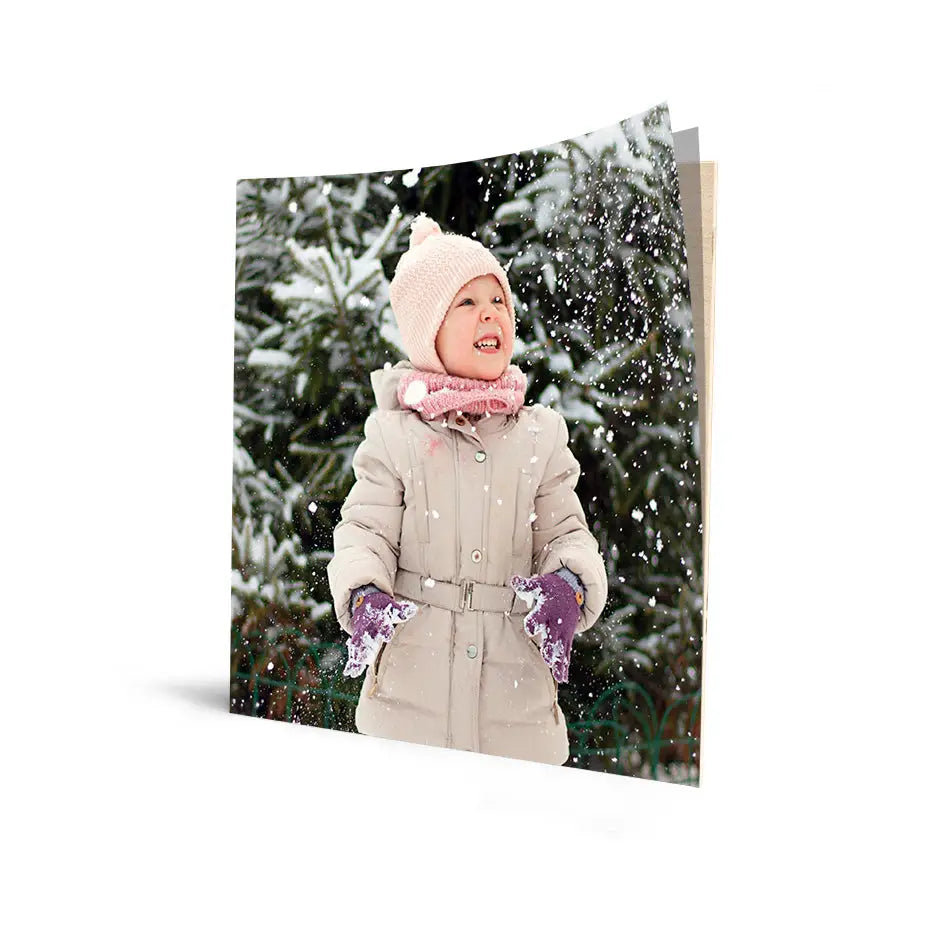 Joyful child in winter gear amid snow on 16x16 Cove Photo Mount Print 50%