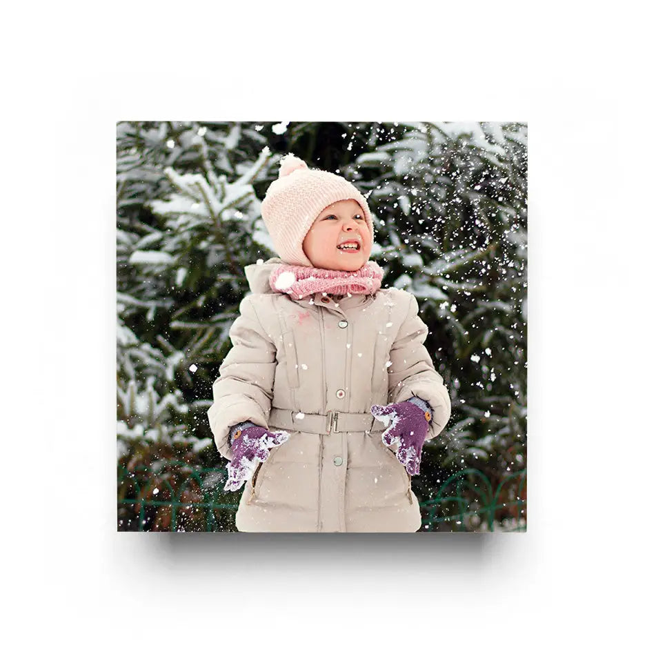 Child smiling in snowy surroundings with 16x16 Cove Photo Mount Print backdrop