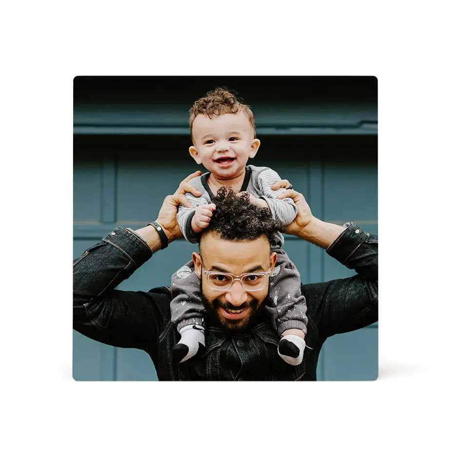 Man holding a baby in his arms on a 16x16 photo tile for cherished memories