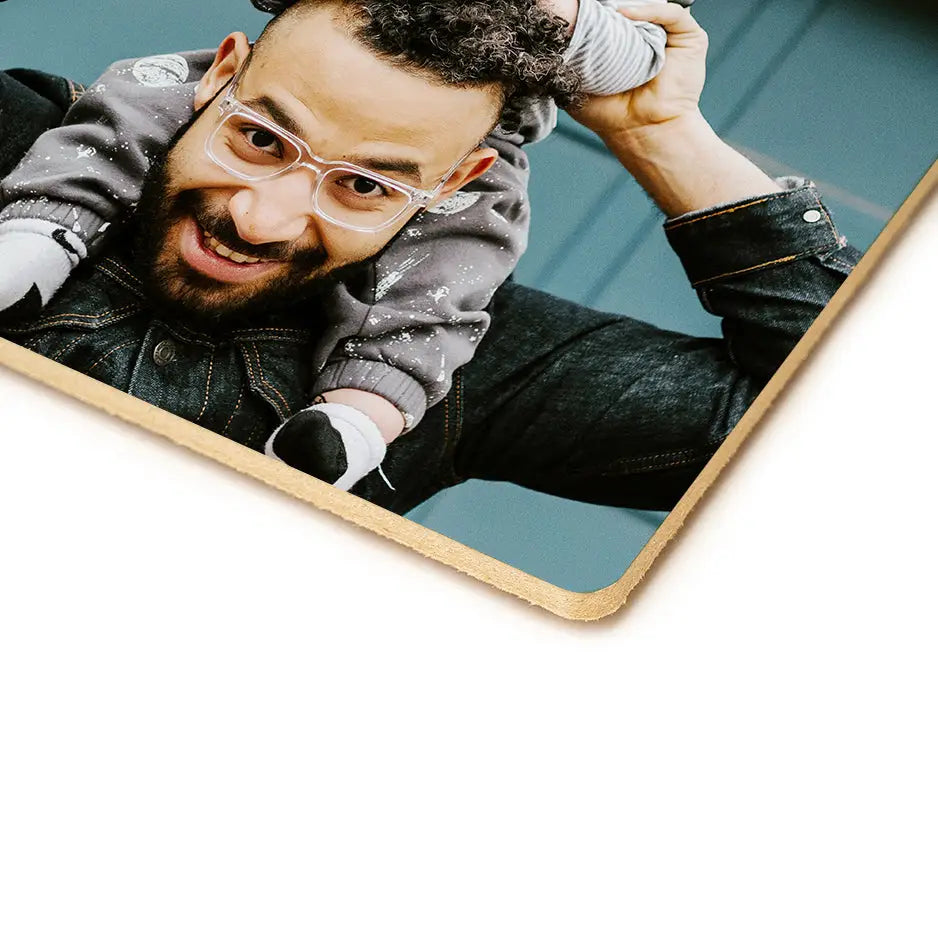 Man with glasses and beard holding his head on a 16x16 photo tile