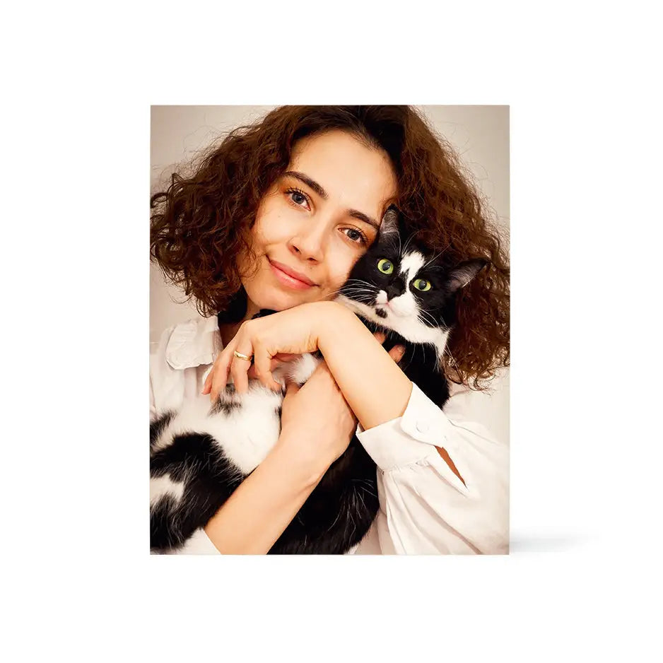 Woman with curly hair holding a cat on a 16x20 Birch Photo Mount Print