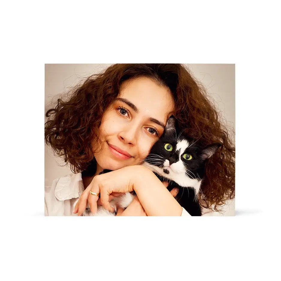 Woman holding a cat in her arms on a 16x20 Birch Photo Mount Print