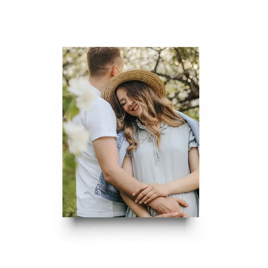 Couple in a field with white flowers featured in a 16x20 Cove Photo Mount Print