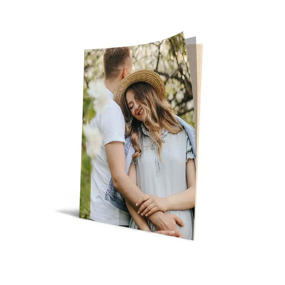 Couple hugging in park on 16x20 cove photo mount print with white background