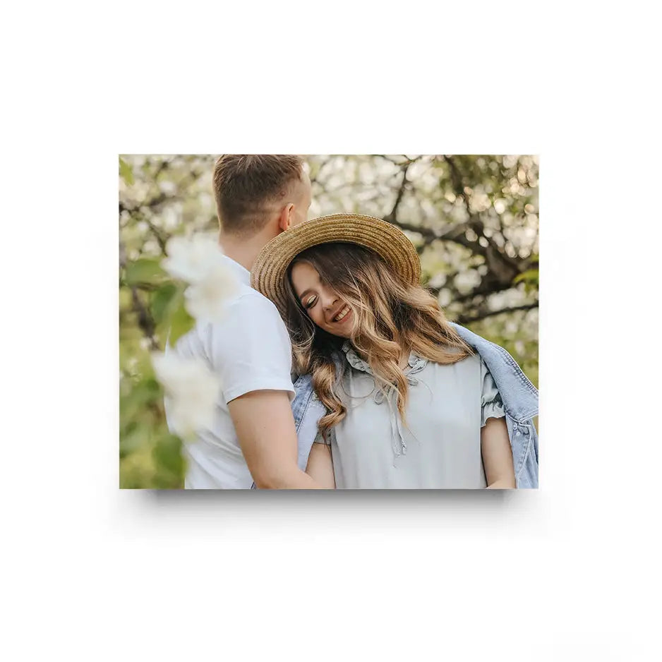 Couple in a field of white flowers featured in 16x20 Cove Photo Mount Print