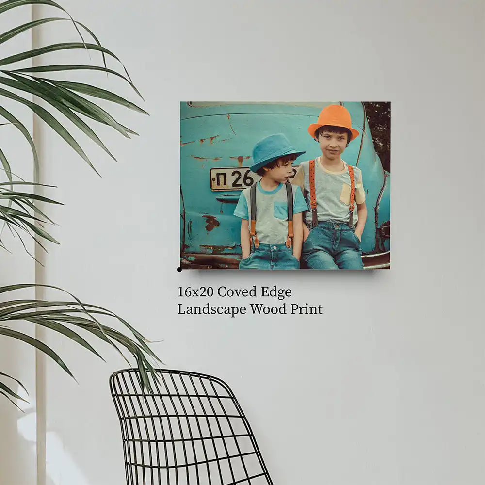 16x20 coved edge landscape wood print featuring two children in hats and suspenders against a turquoise background.