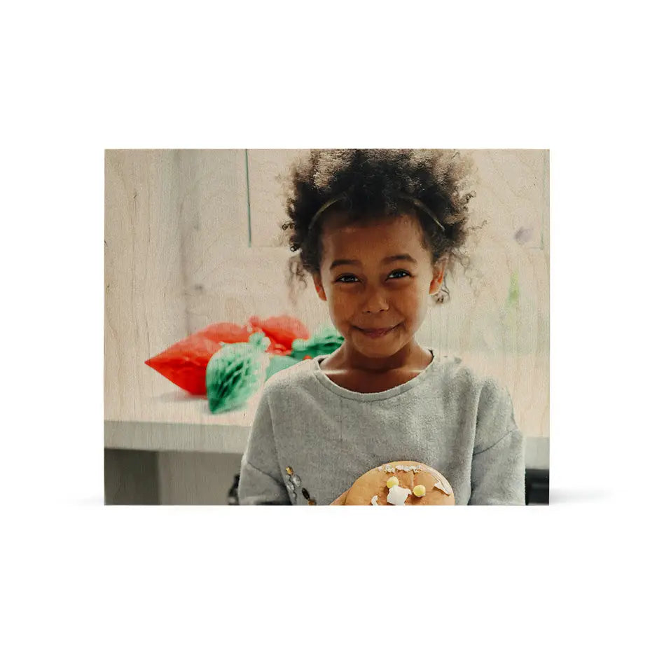 Young child with curly hair smiling with food on a 16x20 wood print vintage