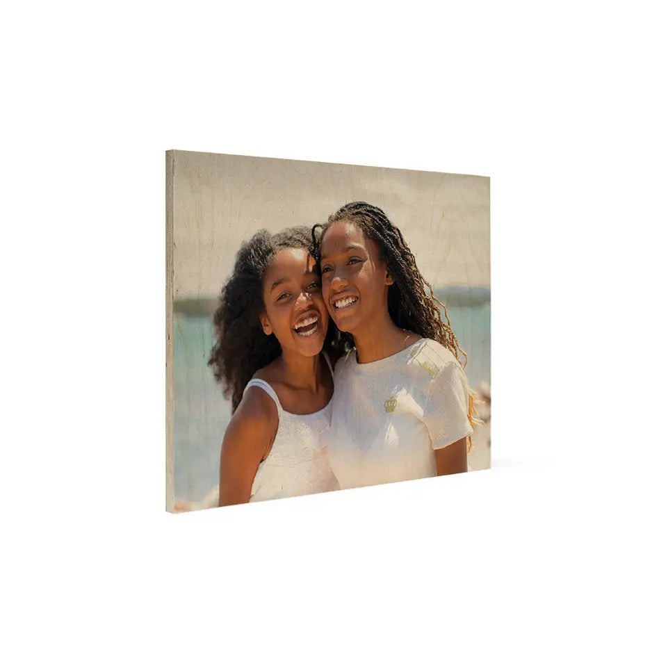 Two girls smiling and hugging on a 16x20 wood print vintage design