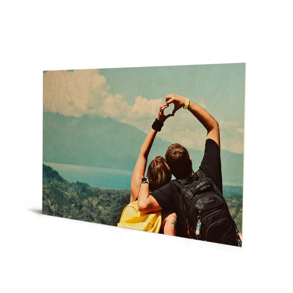 Couple capturing a selfie with a cloud background in a 20x30 Original Cove Print