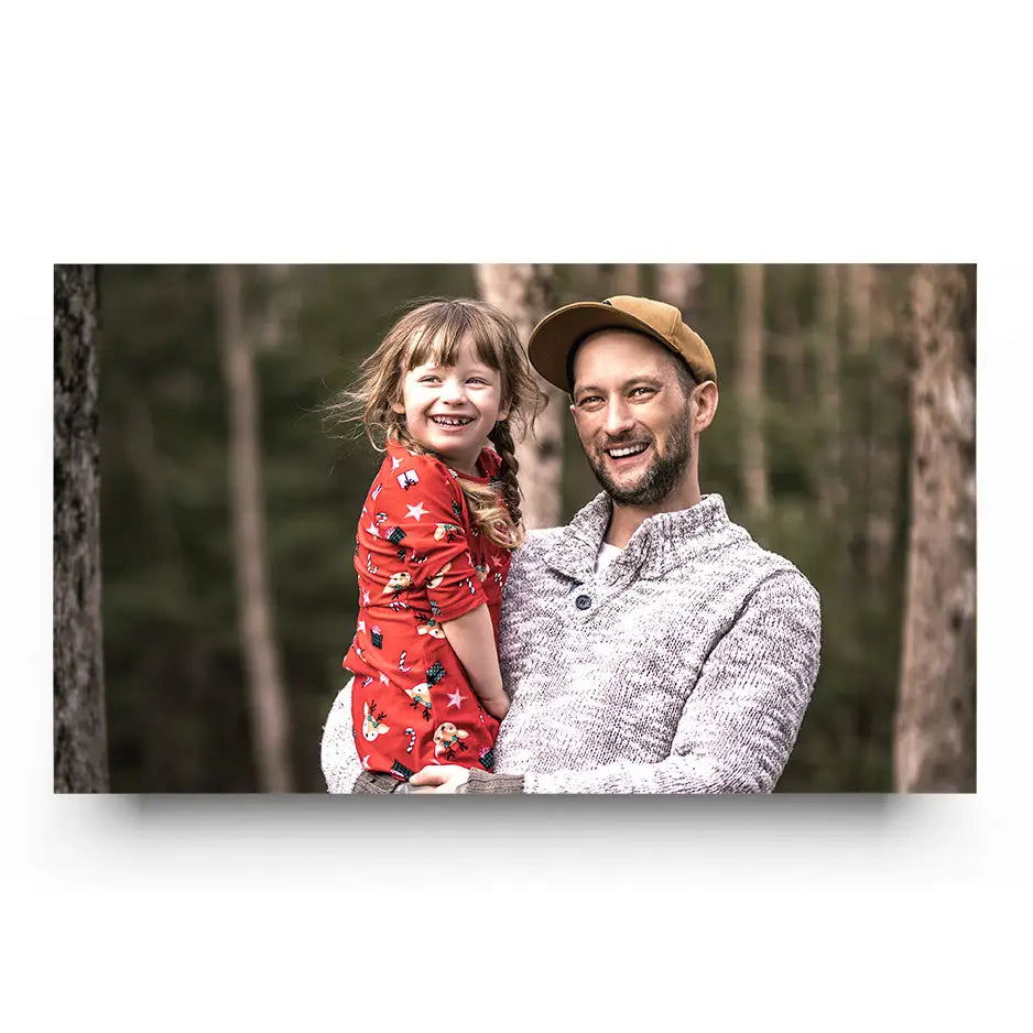 Man holding little girl in arms on 24x36 Cove Photo Mount print