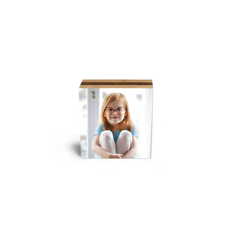 Girl in a blue shirt displayed on a 3x3 Bamboo Photo Block for memorable moments