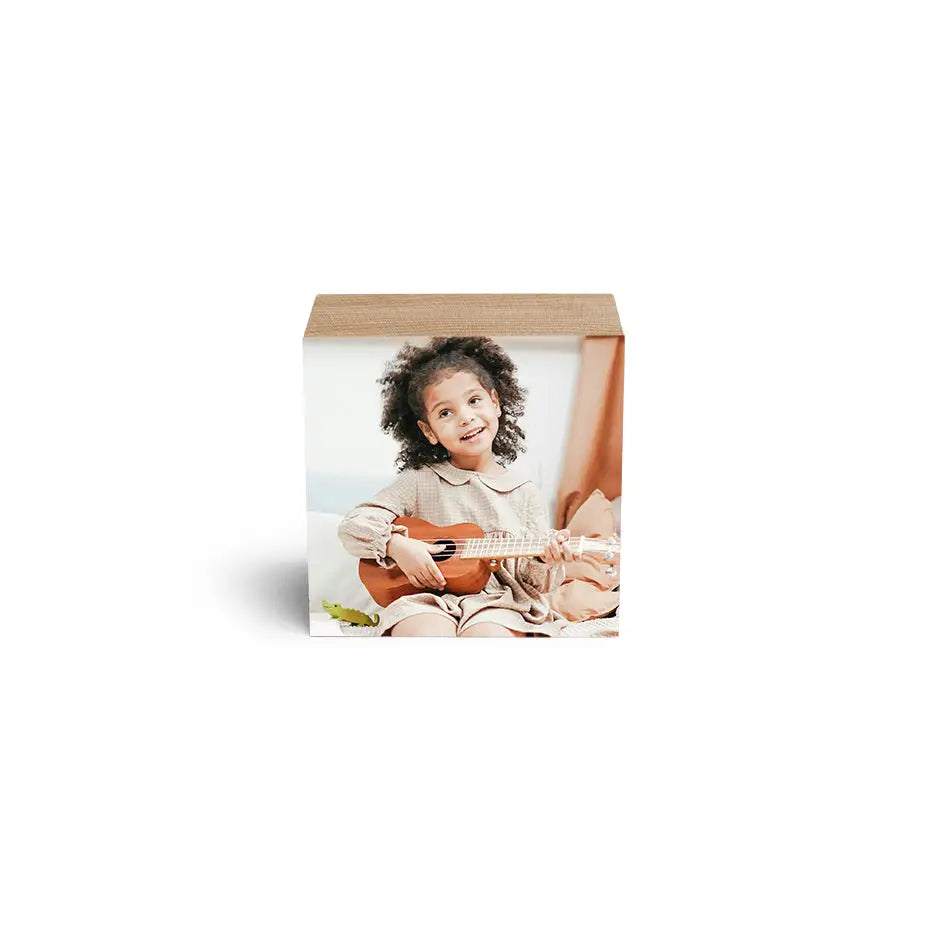 White box displaying a 3x3 Maple Photo Block featuring a baby playing guitar