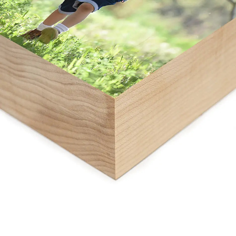 Person walking on grass in a 4x4 Maple Photo Block with a wooden frame