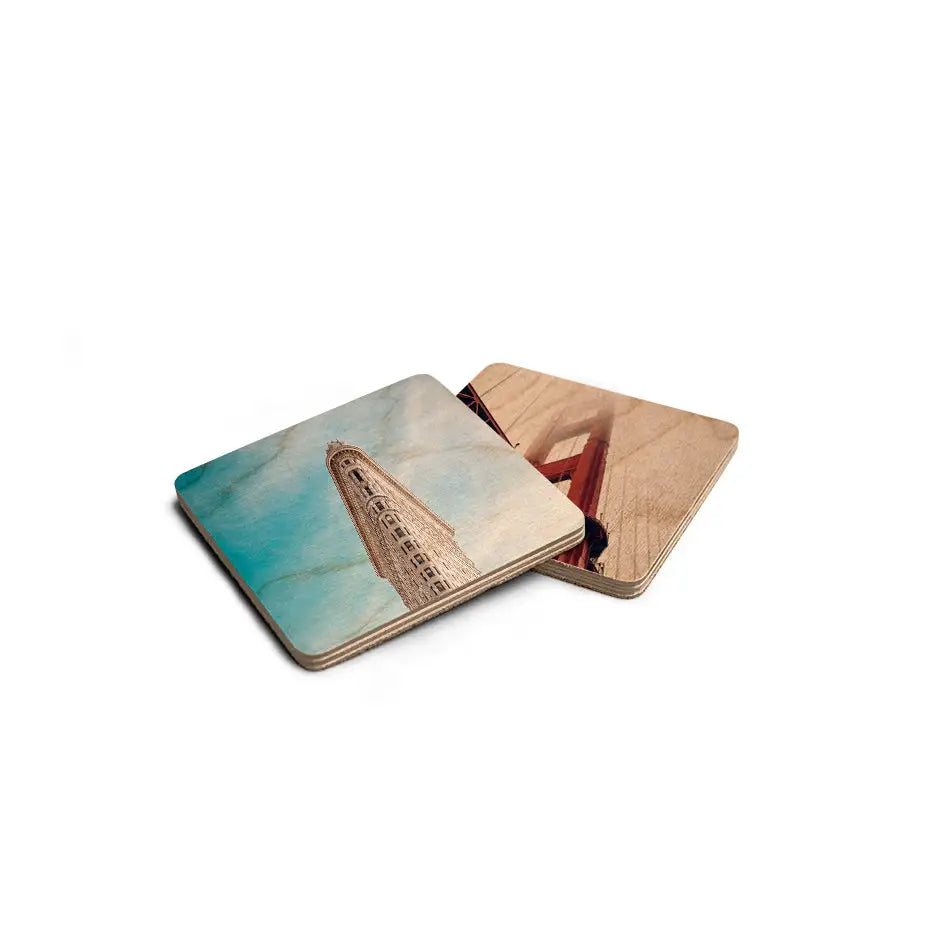 Set of three 4x4 wood coasters featuring a boat on the ocean for stylish decor