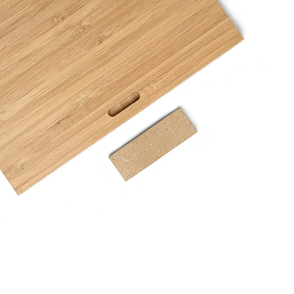 Wooden cutting board featuring a 4x6 blank bamboo panel and a piece of wood on top