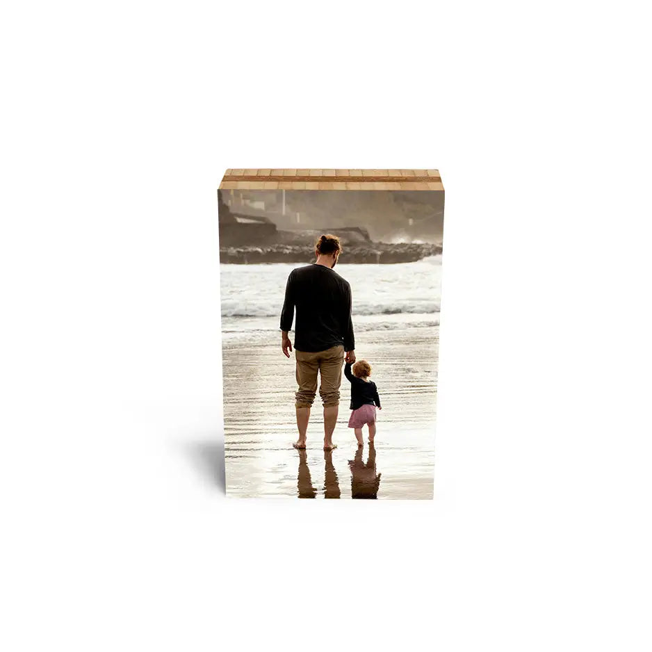 Father and daughter enjoying a beach walk on a 5x7 Bamboo Photo Block