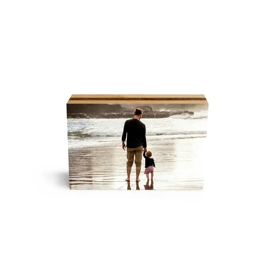 Father and daughter walking on the beach displayed on a 5x7 bamboo photo block