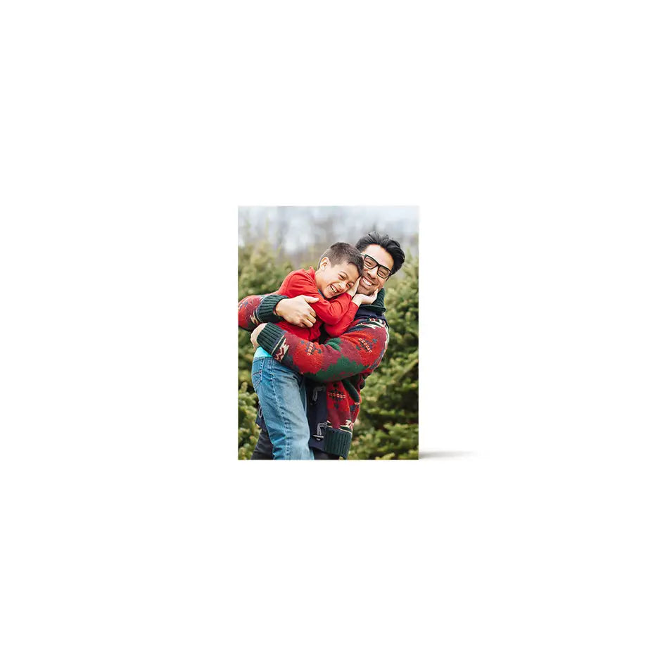 A man carrying a woman in his arms on a 5x7 Birch Photo Mount Print