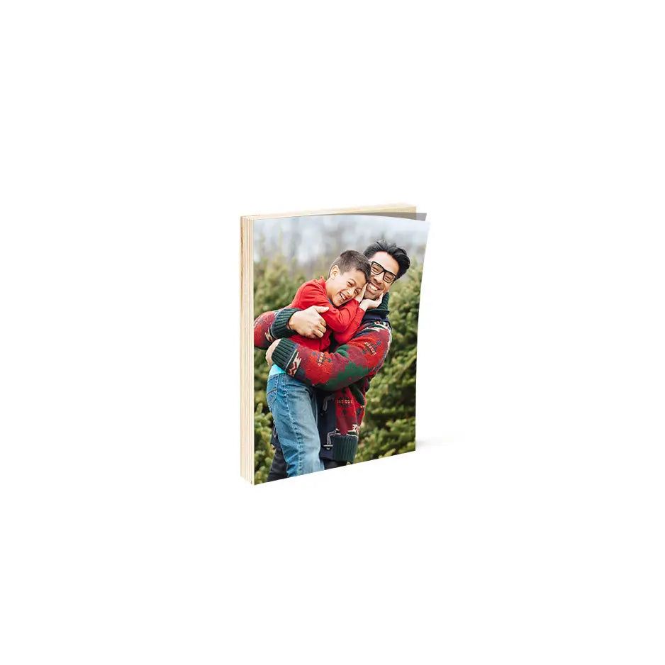 Christmas card featuring a man and woman hugging in a 5x7 birch photo mount