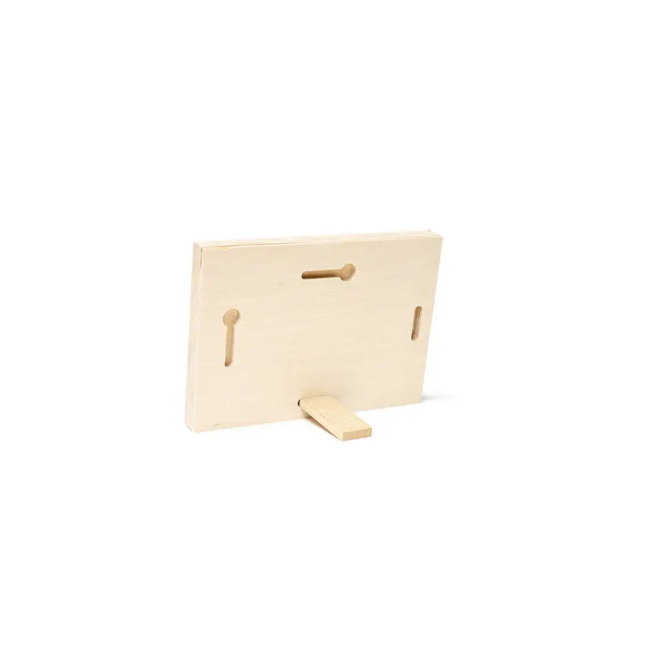 Small wooden easel on white background showcasing 5x7 Birch Photo Mount Print