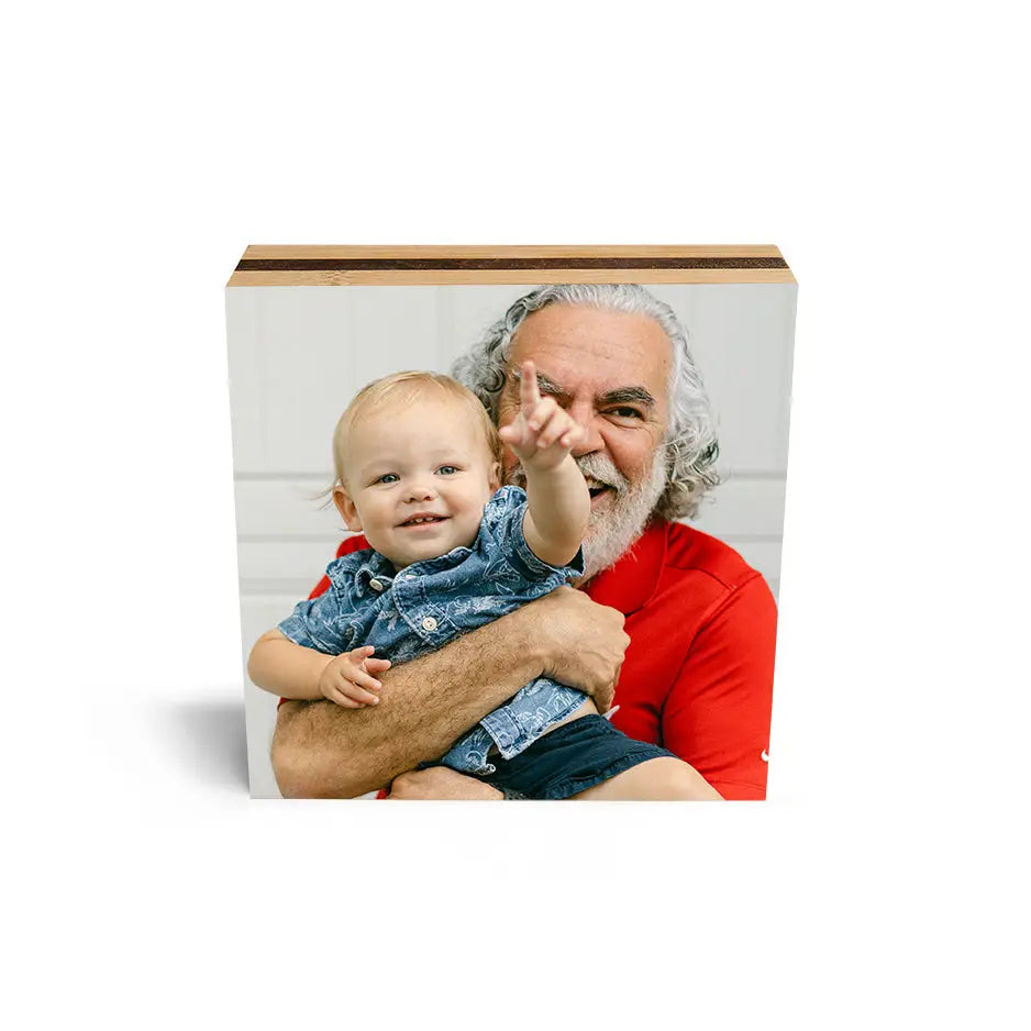 Man holding a baby in arms displayed on a 6x6 Bamboo Photo Block