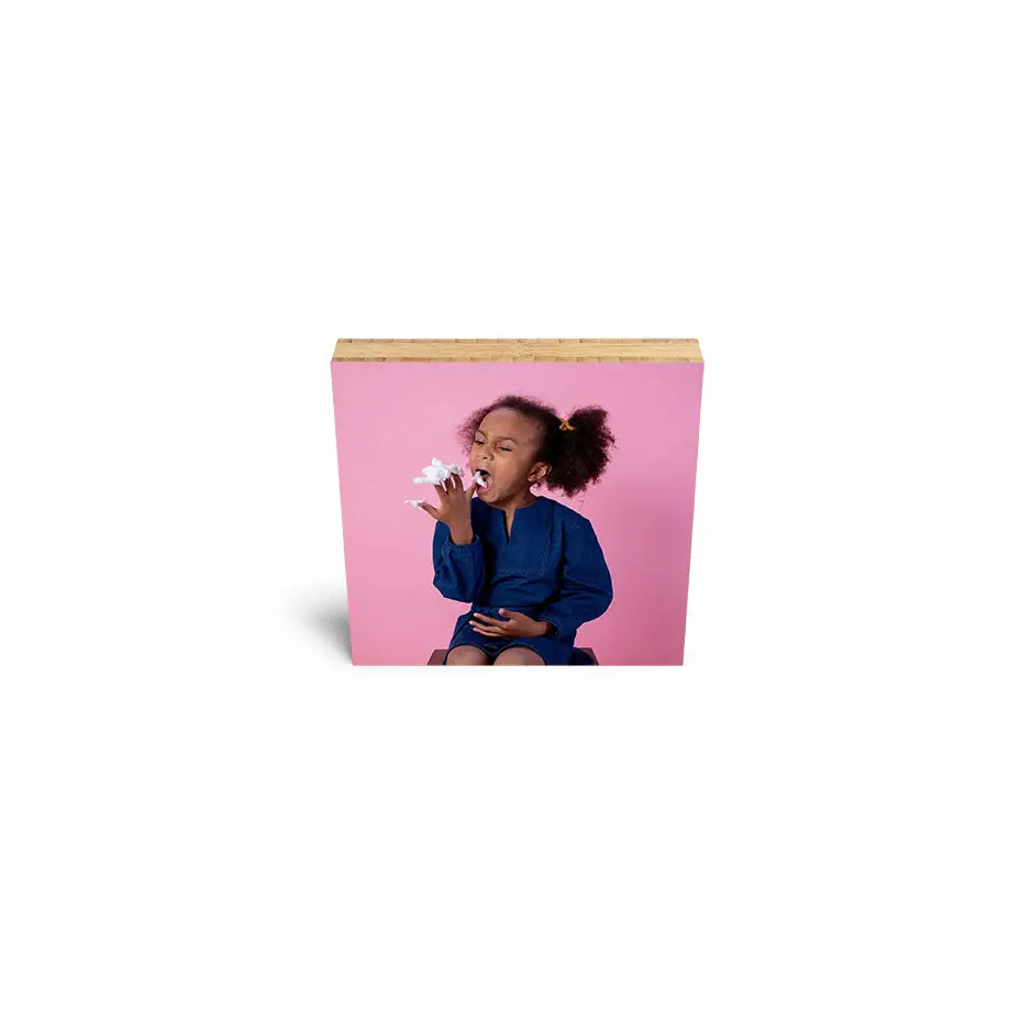 Small card featuring a girl eating a donut on a 6x6 Bamboo Wood Print