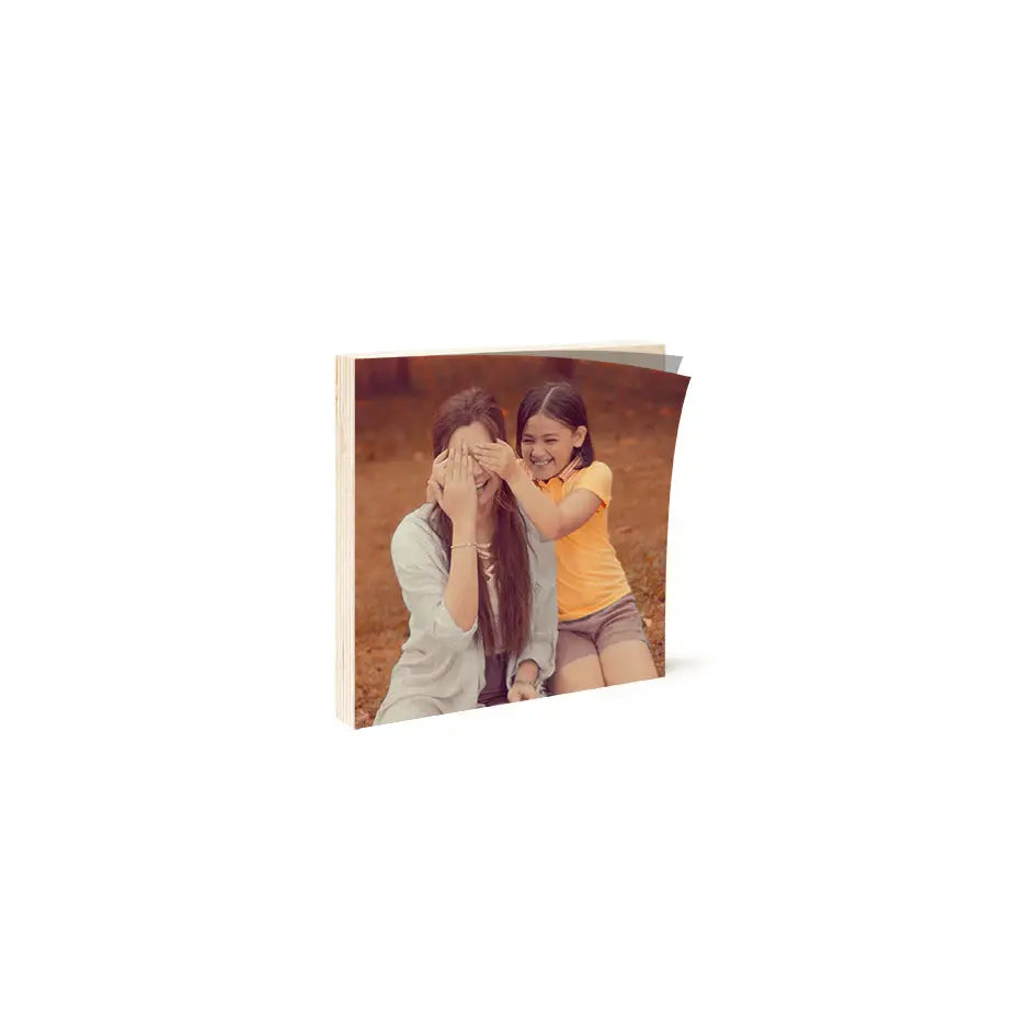 Couple kissing in 6x6 Birch Photo Mount, showcasing a beautiful wood print moment