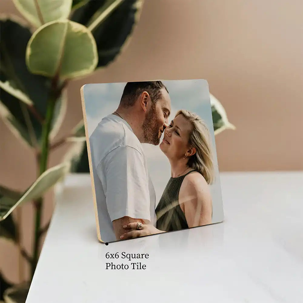 6x6 square photo tile displaying a romantic couple’s moment.