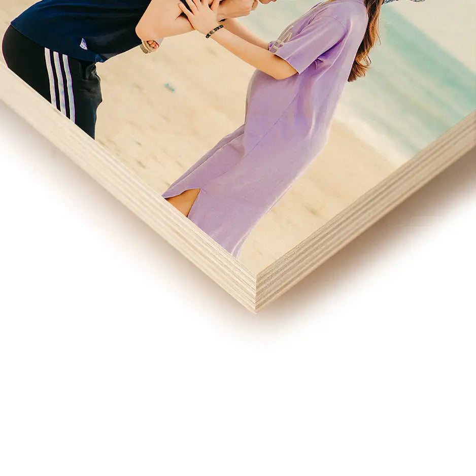 Couple kissing on the beach in a 6x6 wood print collection for photo locket wood