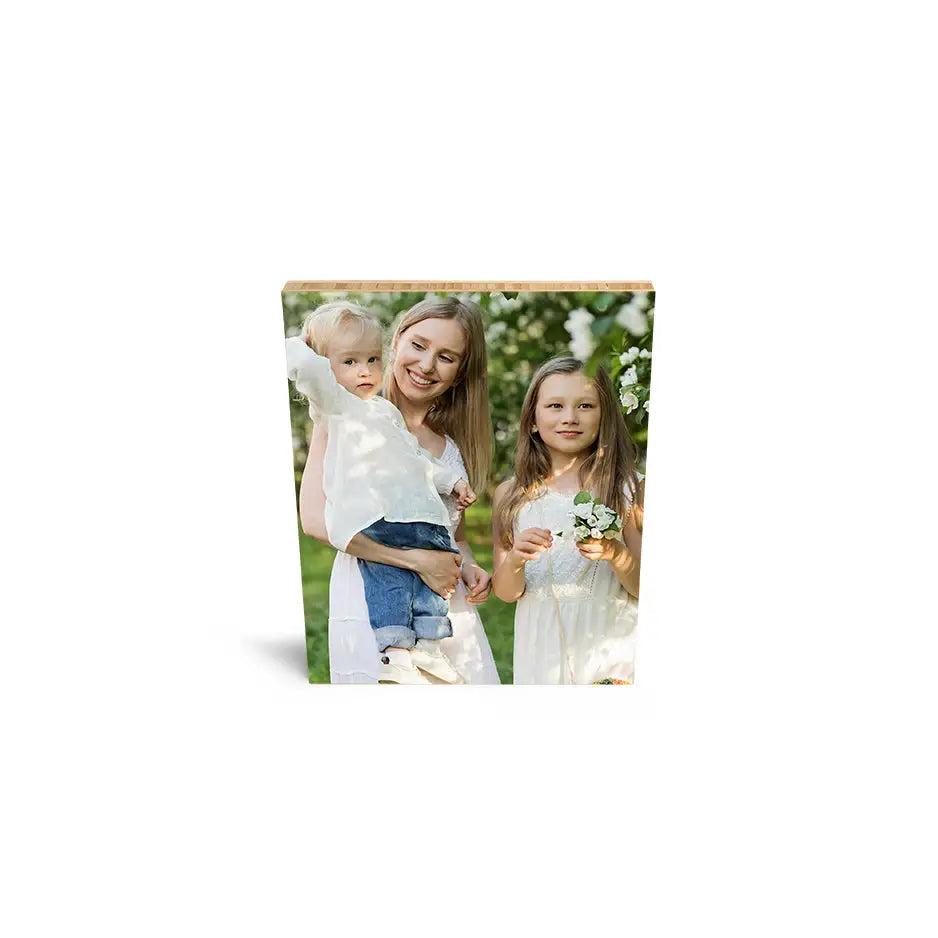 Two girls enjoying a sunny day in a field on an 8x10 bamboo wood print