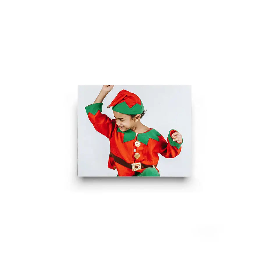 Child in colorful elf costume with red top and green hat, perfect for 8x10 cove photo