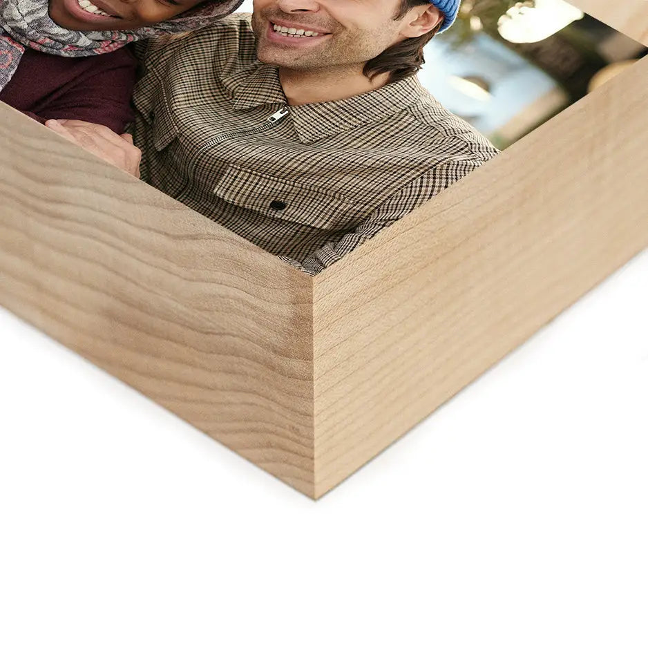 Couple in a wooden box showcasing an 8x10 Maple Photo Block for cherished memories