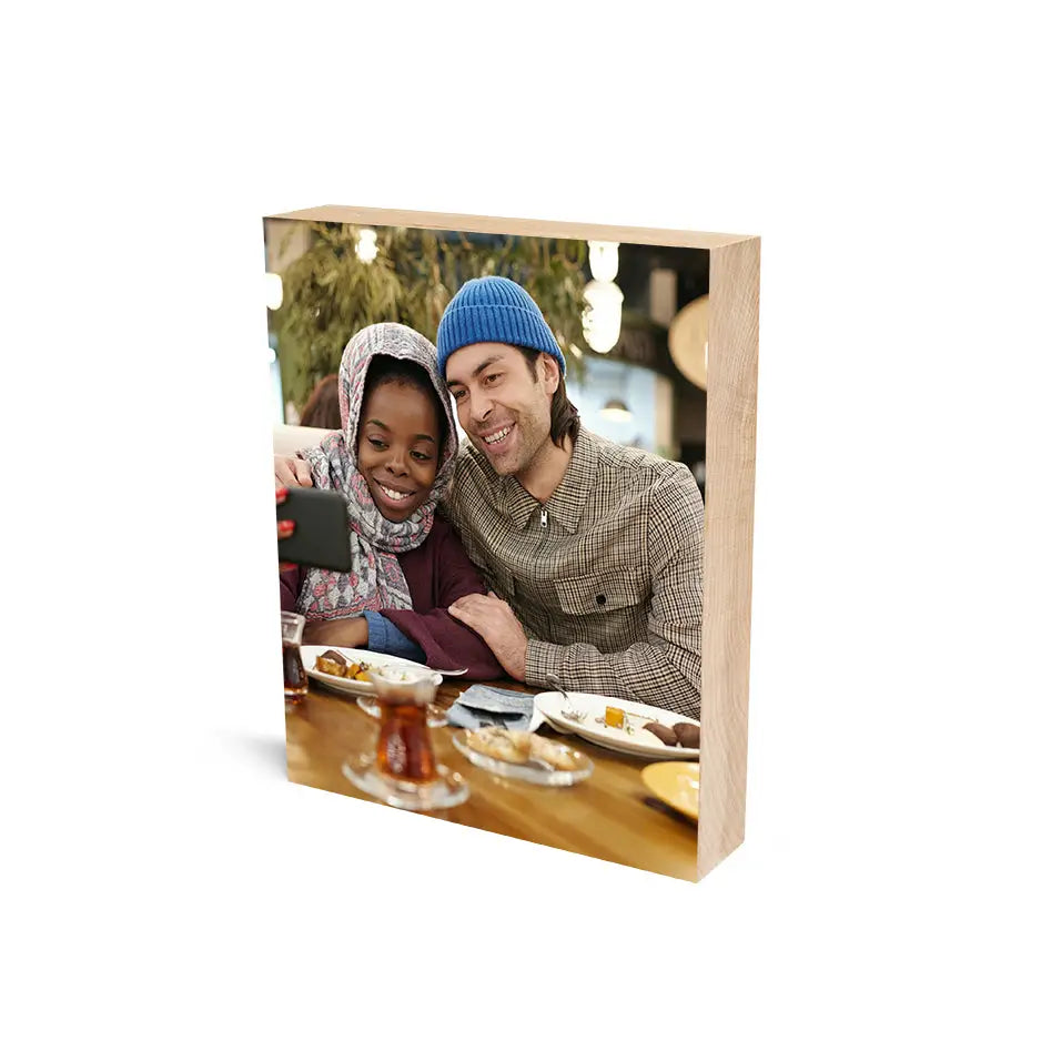 Couple enjoying a meal showcased in an 8x10 Maple Photo Block for lasting memories